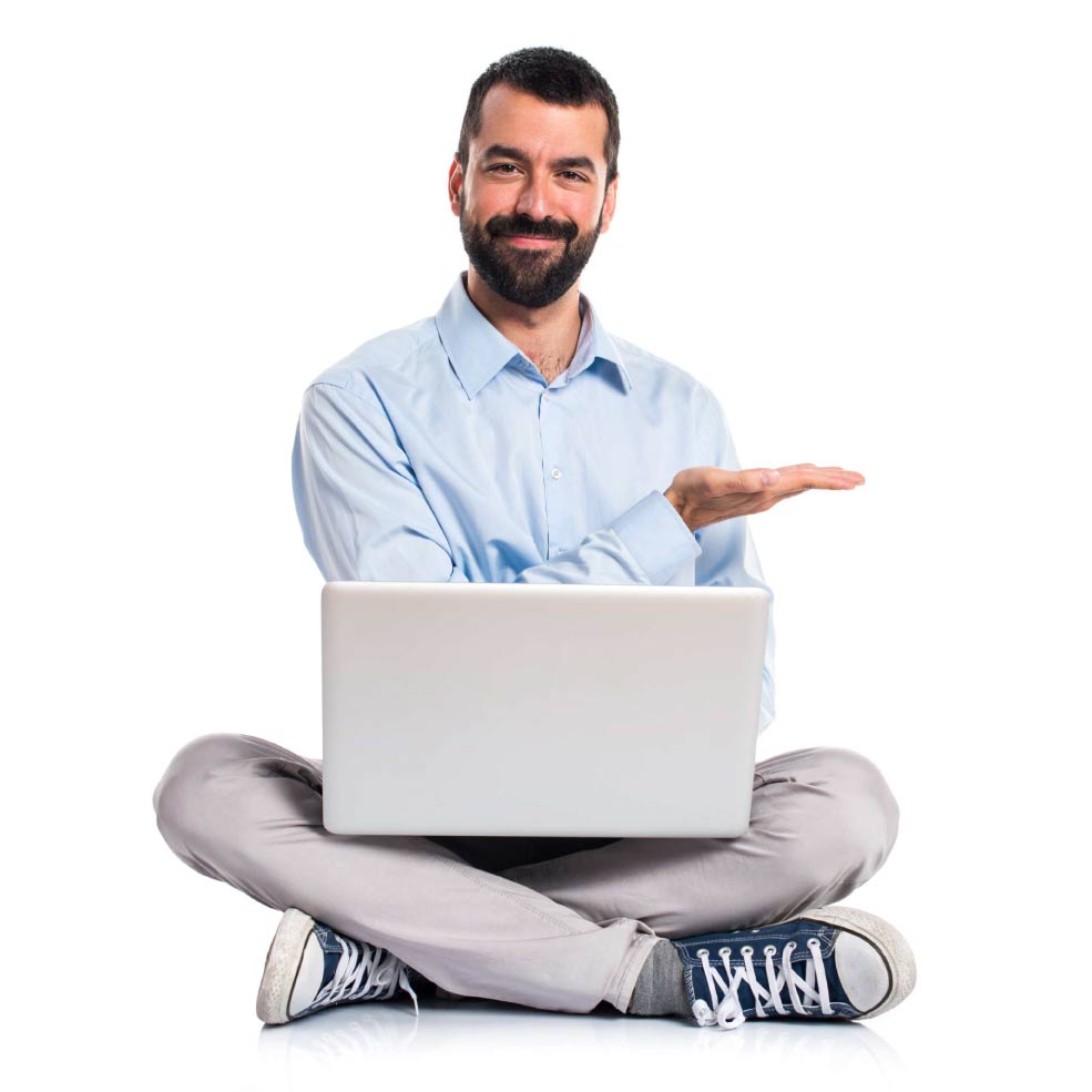 man sitting with a laptop